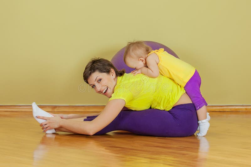 Mother do exercises with her daughter