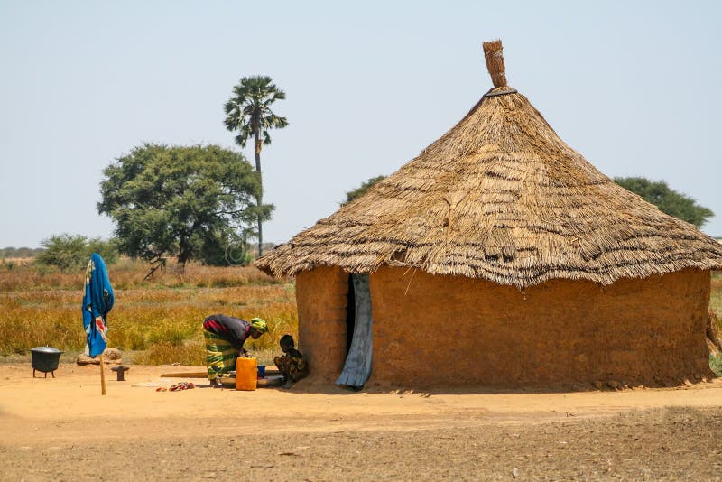 Mother And Dother In Front Of Their House In Senegal 