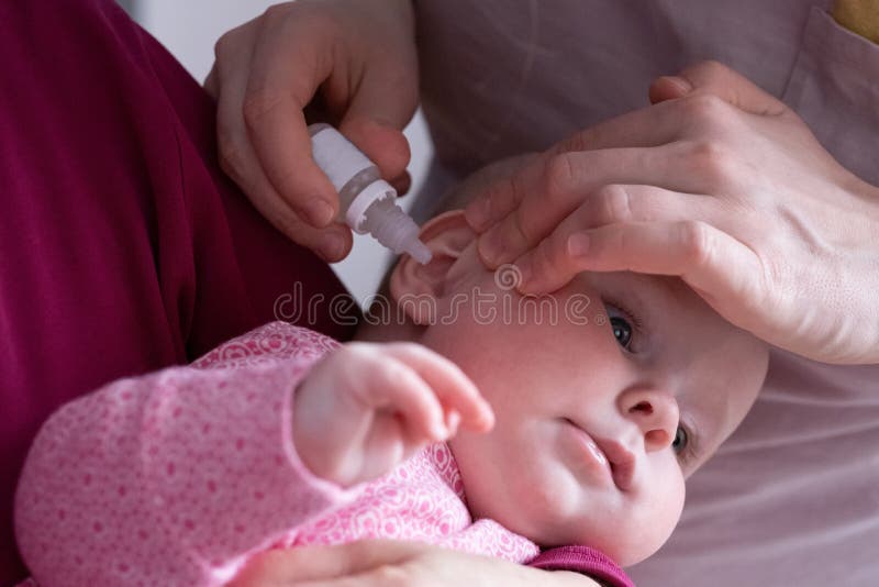 Mother Dribble Medication in Baby Ear. Ear Drops Stock Photo Image of