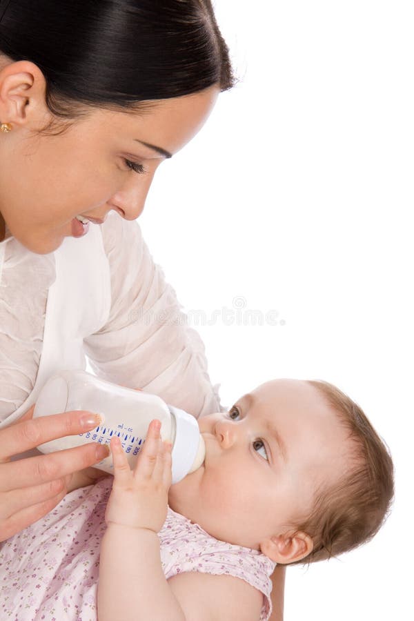 Mother feeding baby daughter royalty free stock photography
