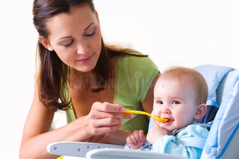 Mother Feeding Baby Food To Baby Stock Photo Image of head, indoors