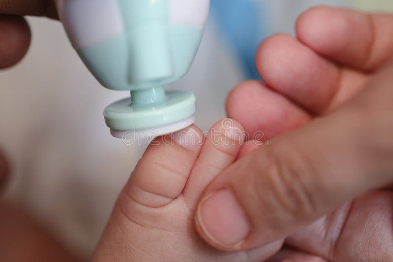 Mother Filling Baby Nails Using Automatic Baby Nail File Machine. Stock Image - Image of elegance, healthy: 149070981 Mother Filling Baby Nails Using Automatic Baby Nail File Machine. Stock Image - Image of elegance, healthy: 149070981