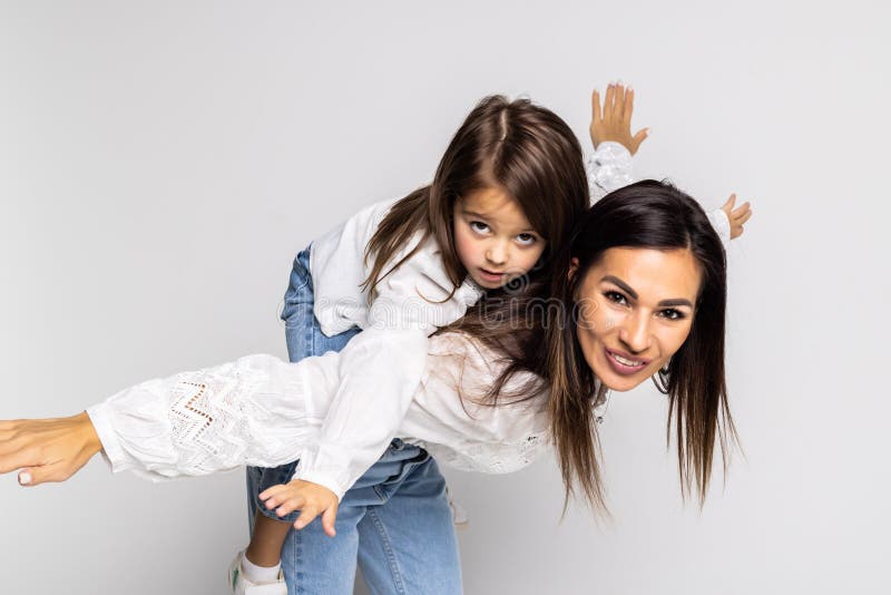 Portrait of young mother giving her son a piggyback ride, Stock Photo,  Picture And Royalty Free Image. Pic. WES-DGOF00925