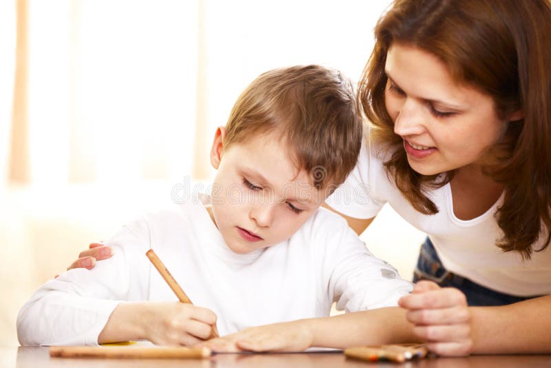 Mother helping with homework to her son