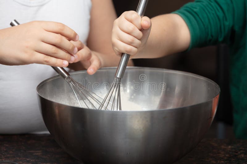 Mother and Her Child Mixing Some Ingredients for a Cake Inside a Bowl
