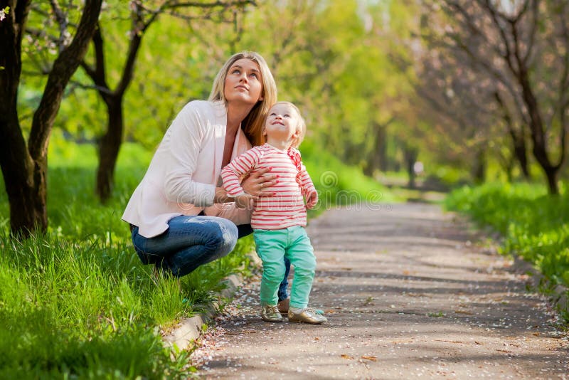 Mother and her child in spring park