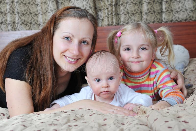 Mother and her children stock photo. Image of cute, families - 22923544