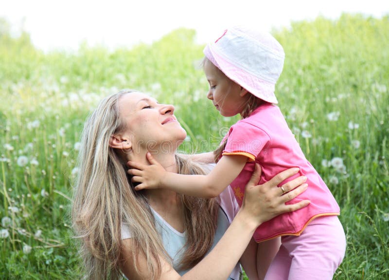 Mother and her daughter in the park on sunny day