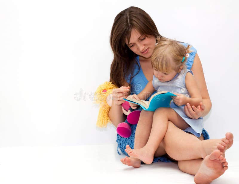 Mother with her daughter reading a book