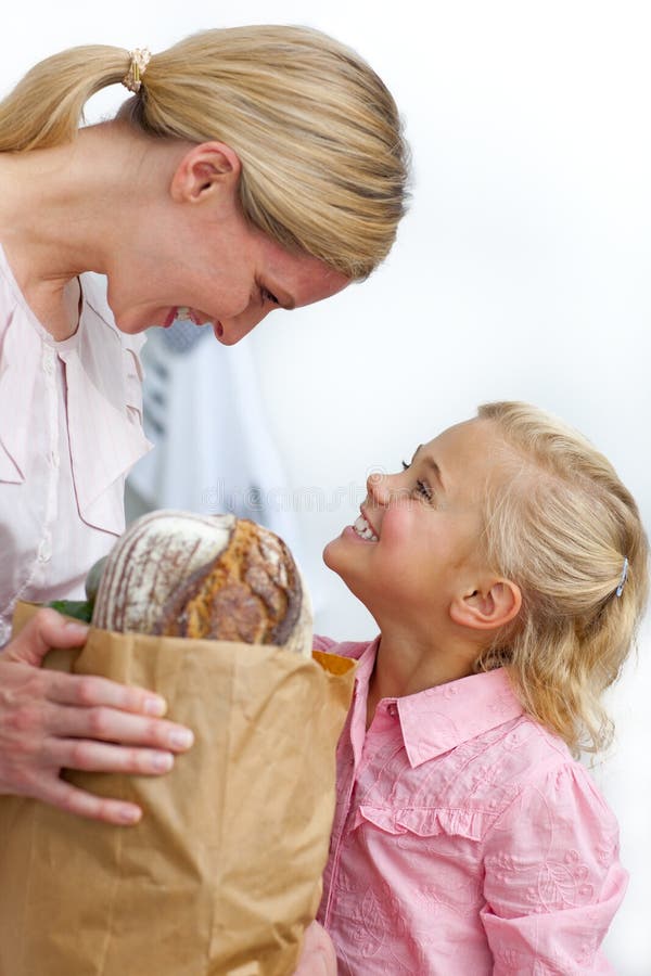 Mother and her daughter unpacking grocery bag royalty free stock photo Mother and her daughter unpacking grocery bag royalty free stock photo