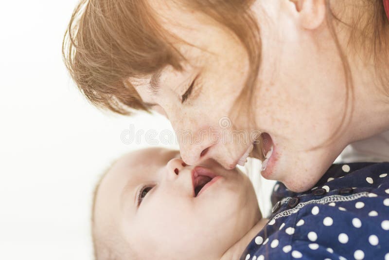 Mother and Her Newborn Little Child Communicating Together