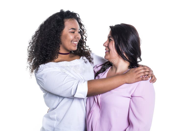 Mother and her teenage daughter isolated on white