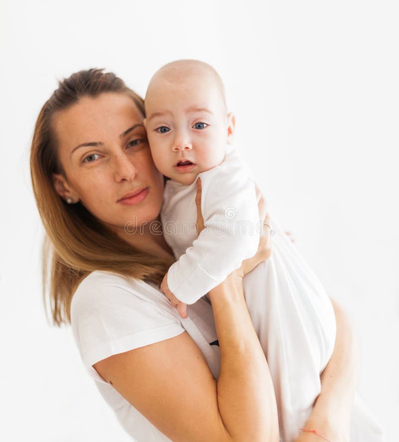 Mother holding baby stock image. Image of women, white 39333283
