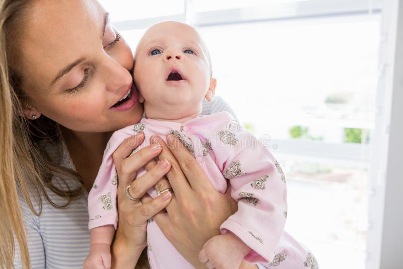 Mother Holding Her Baby Boy Stock Photo - Image of holding, care: 77871460