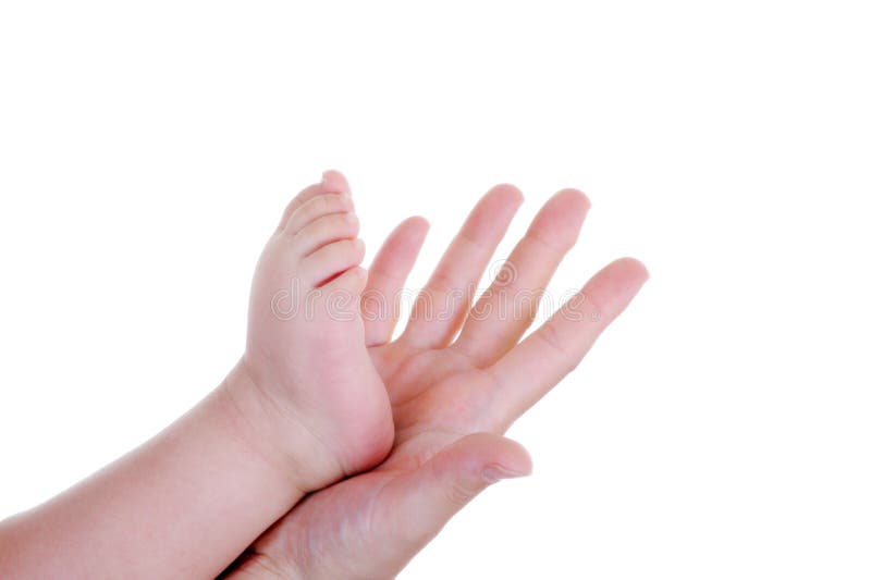 Mother holding her baby foot in hand