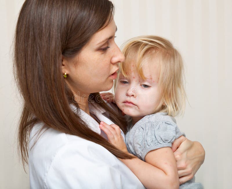A mother is holding a sick girl. royalty free stock image A mother is holding a sick girl. royalty free stock image