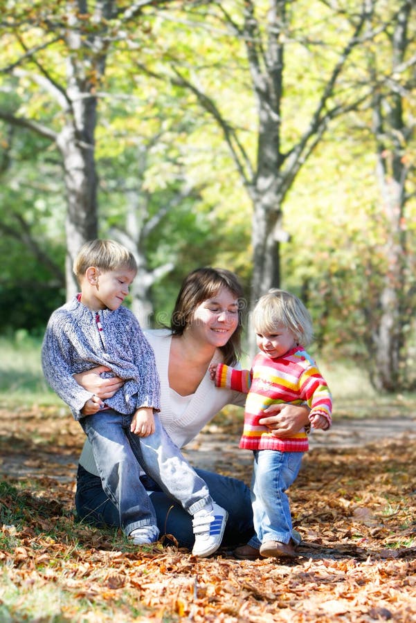 Mother with kids in autumn park