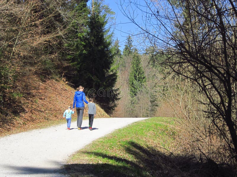 Mother with kids hiking in forest royalty free stock photography Mother with kids hiking in forest royalty free stock photography