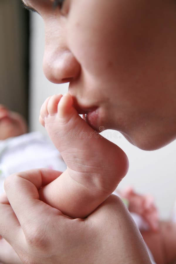 mother kiss baby& x27;s foot royalty free stock image mother kiss baby& x27;s foot royalty free stock image