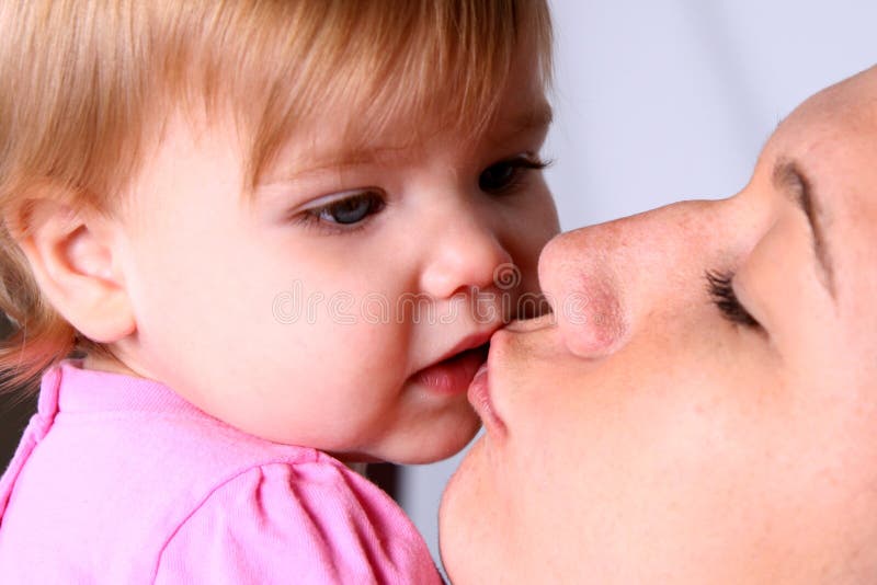 A Mother Kisses Her Little Girl