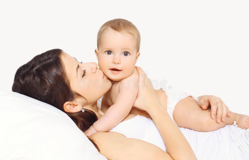 Mother Kissing Baby and Lying on the Bed Stock Photo Image of clean
