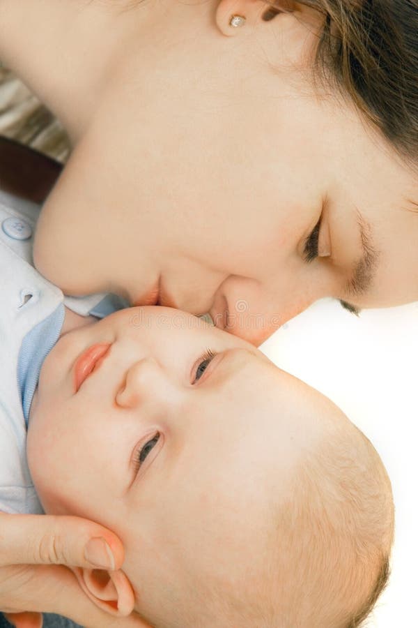 Mother kissing her baby