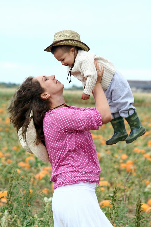 Mother Lifting Her Child Up Stock Image Image of women, love 21852837