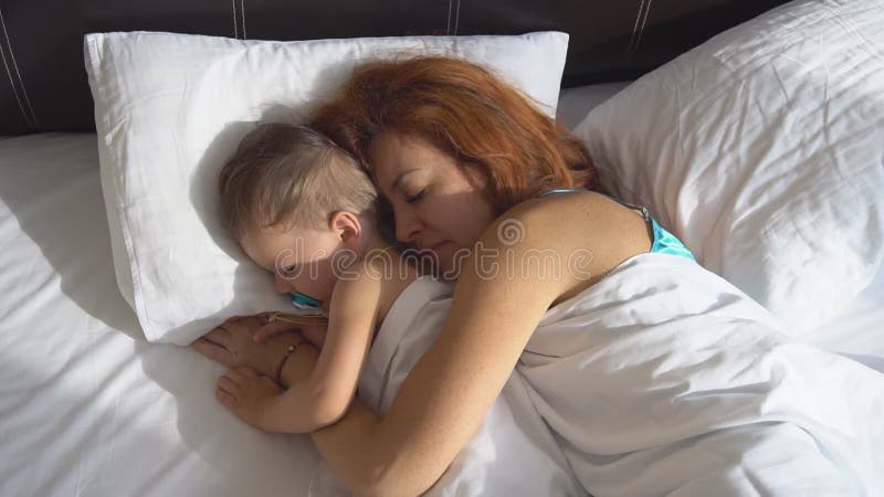 800px x 450px - Mom with Baby Son Awake in the Morning in the Bedroom Stock Footage - Video  of light, play: 102249804