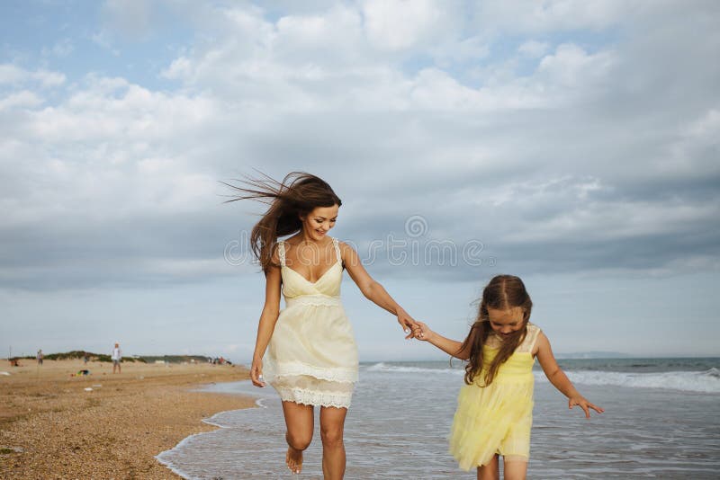 Beautiful Young Mother And Daughter Having Fun Resting On The Sea They 