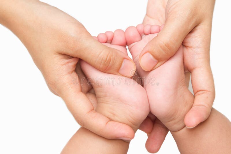 Mother massaging little baby's feet stock photos Mother massaging little baby's feet stock photos