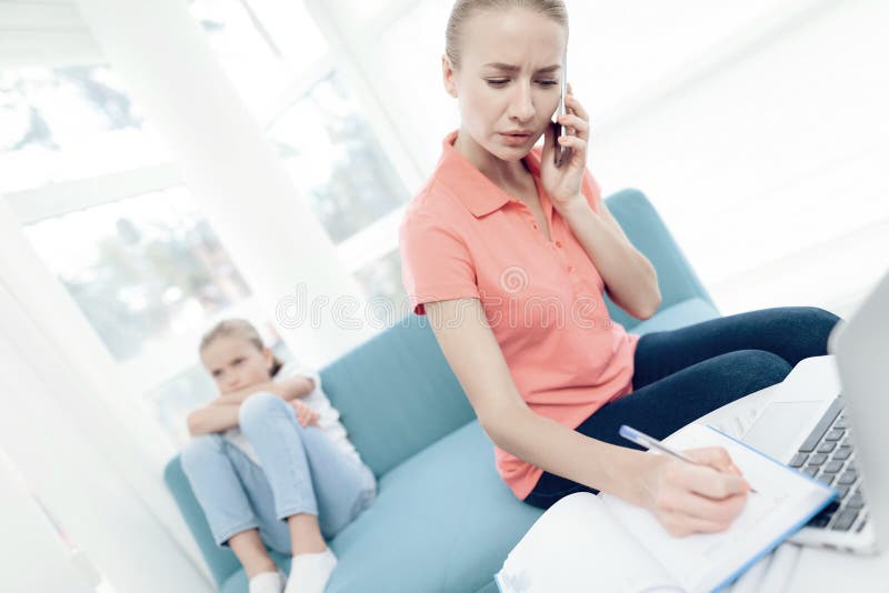 Mother is passionate about working on a laptop. Daughters do not have enough attention from mother.