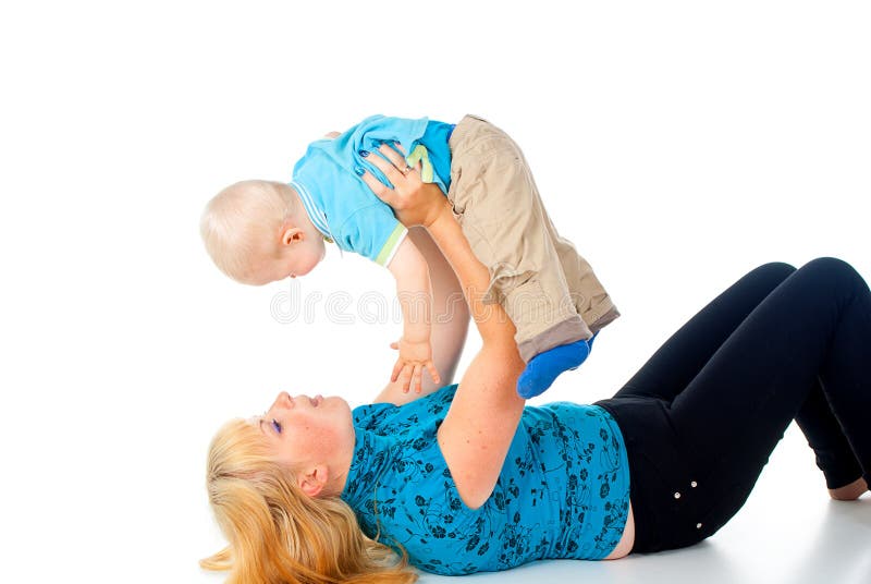 Mother playing with child holding hands