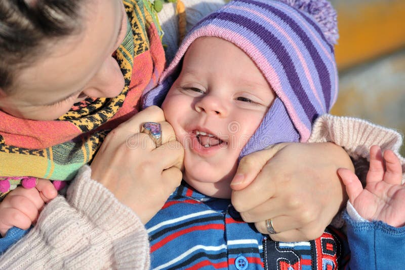 Mother playing with baby stock photos