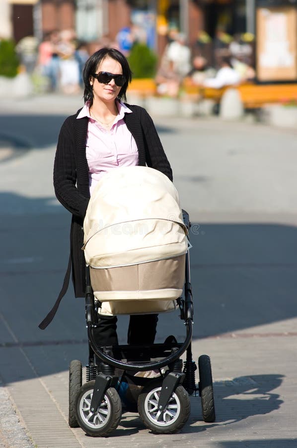 Mother pushing pram