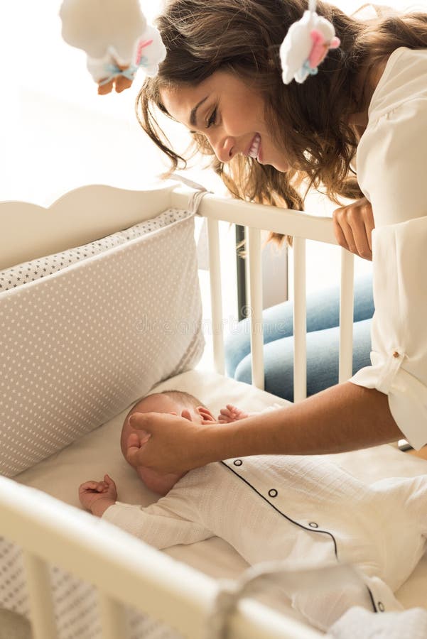 Mom Putting Baby To Sleep Baby Bed Stock Photos Free And Royalty Free