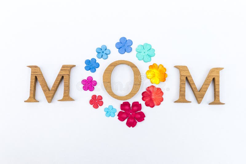 Wooden Font Arrangement In Mom Word With Colorful Paper Flower Isolate ...