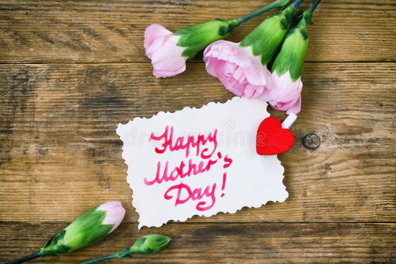 Mother`s Day card, pink carnations and note stock photography Mother`s Day card, pink carnations and note stock photography