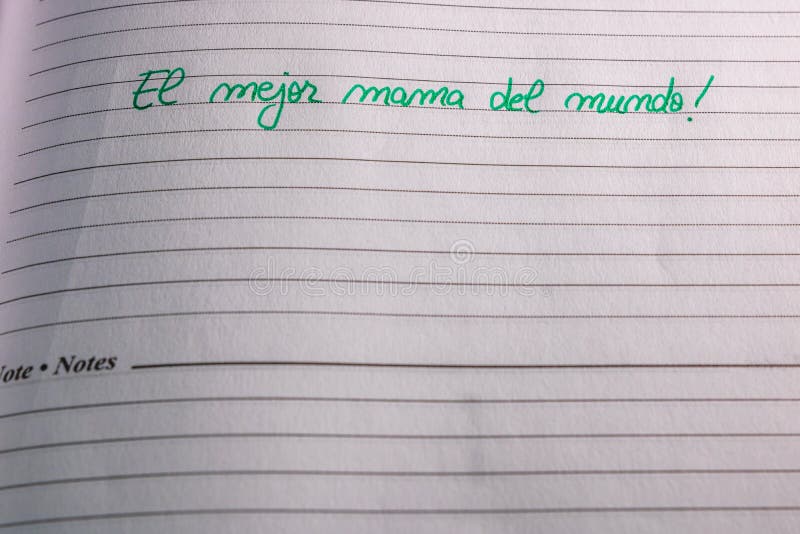 Mother`s day concept. Writing text for mother on personal agenda. The best mom in the world In Spanish El mejor mama del mundo.  stock photography