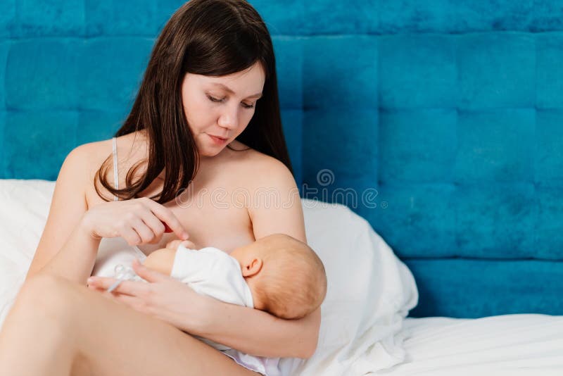 Nudist female breastfeeding