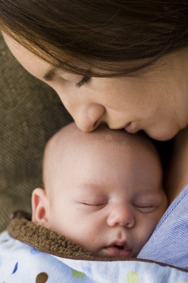 Mother and sleeping newborn