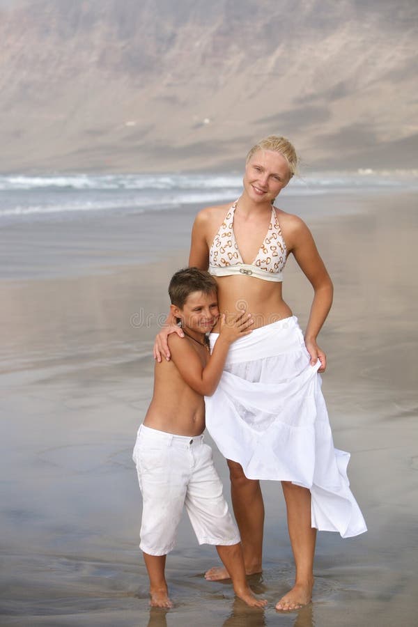 Mother and son on the beach. 