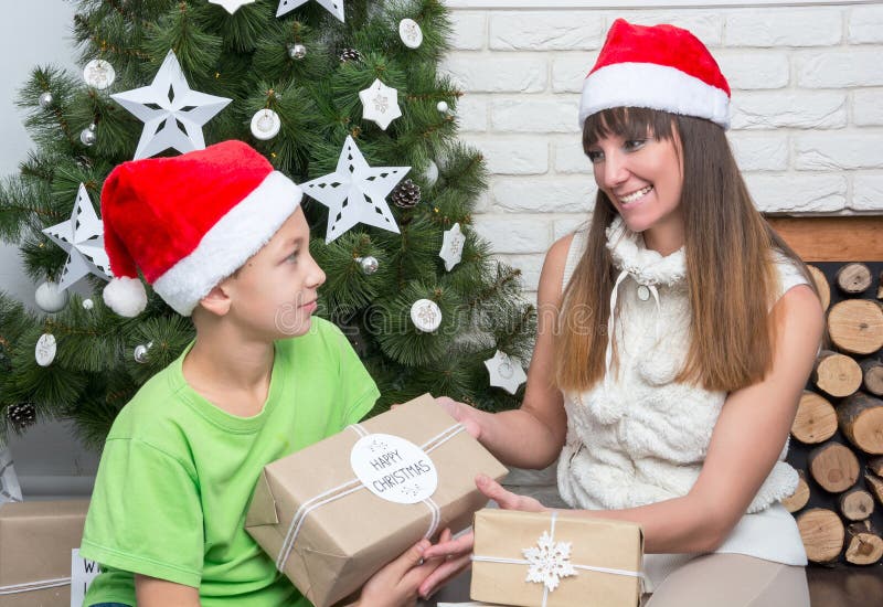 Mother and Son are Exchanged Christmas Gifts Stock Photo Image of home, interior 62153594