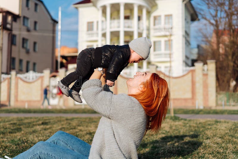 Mother and son on the grass stock photography Mother and son on the grass stock photography