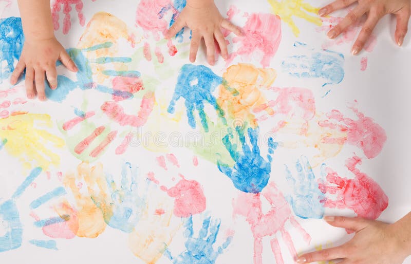 Mother and son hands painting