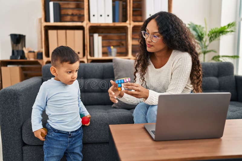 Mother and Son Having Educational Therapy Using Puzzle at Pedagogue