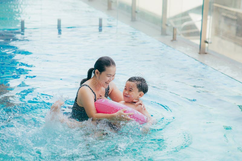 Mother and Son Having a Great Time in the Pool Stock Image Image of
