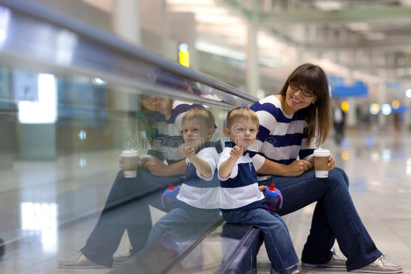 Mother and son at an international airport