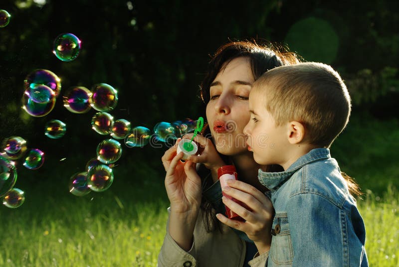 Mother and son making soap bubbles