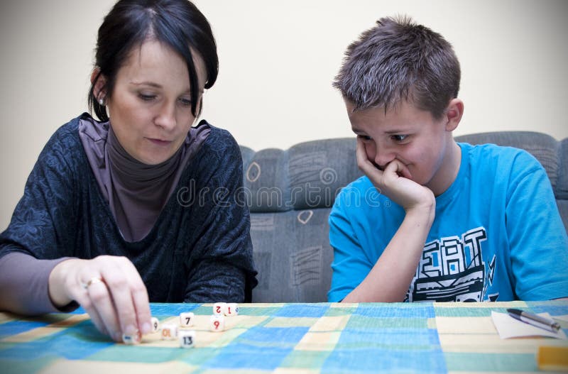 Mother and son playing dice