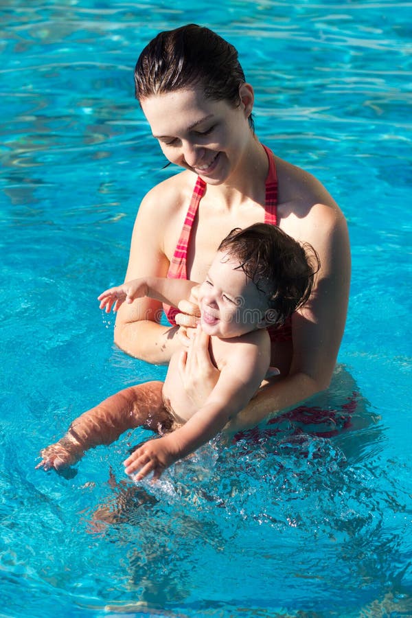 Mother with son in pool